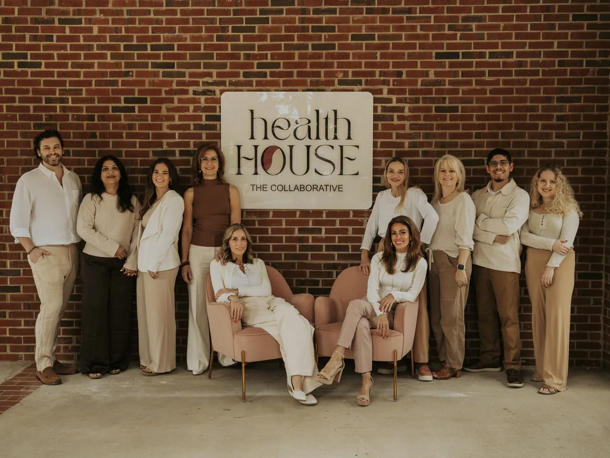 The Collaborative practitioners gathered under the Health House sign in North Raleigh